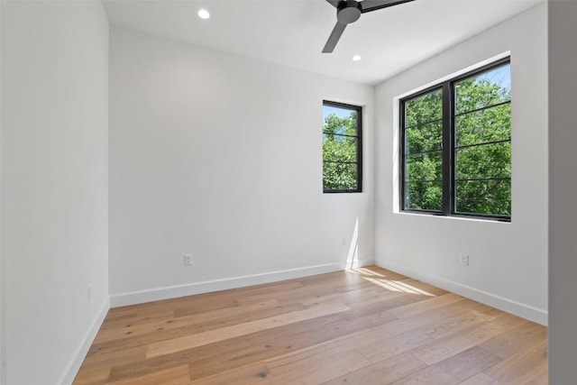 5218 Valley Oak Dr, Austin, TX 78731 - spare room featuring a ceiling fan, light wood finished floors, and recessed lighting