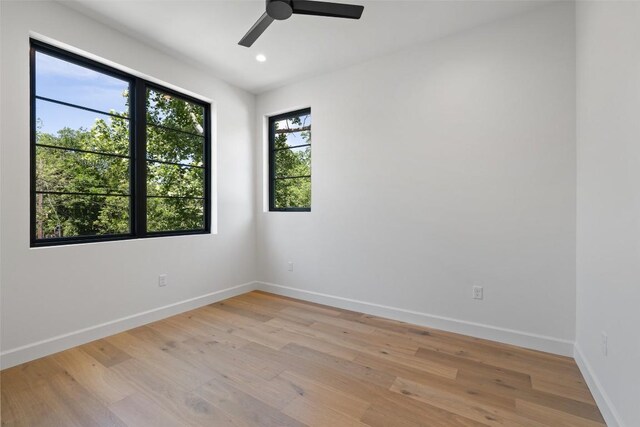 5218 Valley Oak Dr, Austin, TX 78731 - spare room with light wood-style floors, a ceiling fan, and recessed lighting