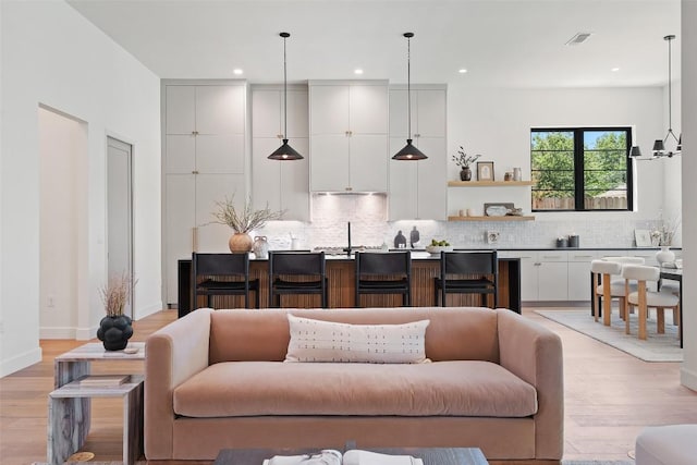 5218 Valley Oak Dr, Austin, TX 78731 - living area featuring light wood-style flooring and recessed lighting