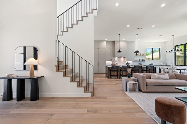 5218 Valley Oak Dr, Austin, TX 78731 - living area with recessed lighting, stairs, and light wood-type flooring