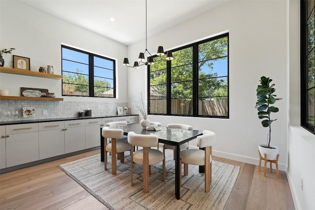 5218 Valley Oak Dr, Austin, TX 78731 - dining space with a chandelier, light wood-type flooring, plenty of natural light, and recessed lighting