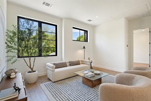 5218 Valley Oak Dr, Austin, TX 78731 - living room featuring light wood finished floors and recessed lighting