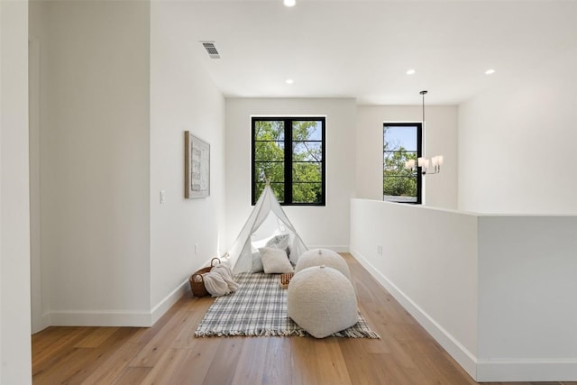 5218 Valley Oak Dr, Austin, TX 78731 - living area with light wood finished floors, recessed lighting, and a chandelier