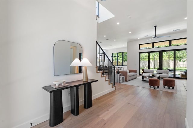 5218 Valley Oak Dr, Austin, TX 78731 - stairway with recessed lighting, wood finished floors, and a ceiling fan