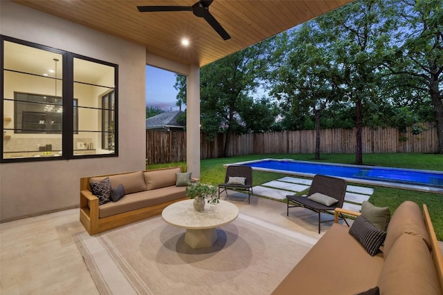 5218 Valley Oak Dr, Austin, TX 78731 - fenced backyard with outdoor lounge area, ceiling fan, and a patio area