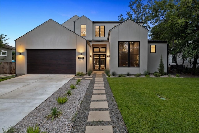 5218 Valley Oak Dr, Austin, TX 78731 - contemporary home with french doors, a garage, concrete driveway, and stucco siding