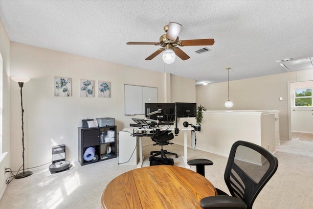 601 Wagon Wheel Trl, Pflugerville, TX 78660 - home office featuring ceiling fan, a textured ceiling, attic access, and baseboards