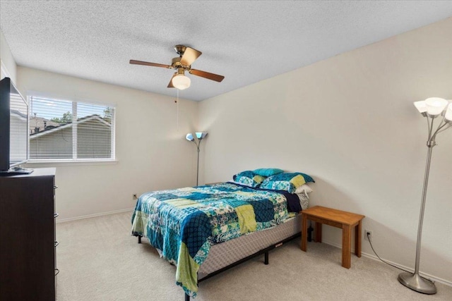 601 Wagon Wheel Trl, Pflugerville, TX 78660 - carpeted bedroom featuring a ceiling fan and a textured ceiling