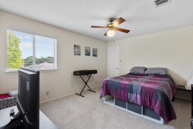 601 Wagon Wheel Trl, Pflugerville, TX 78660 - carpeted bedroom with a textured ceiling and ceiling fan