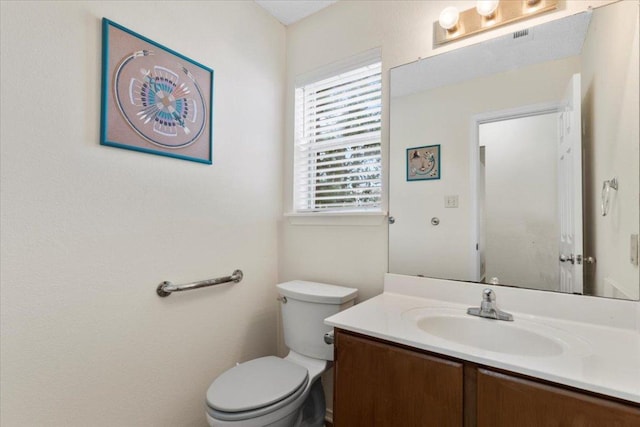 601 Wagon Wheel Trl, Pflugerville, TX 78660 - half bathroom with vanity and toilet
