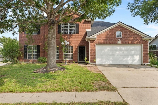 601 Wagon Wheel Trl, Pflugerville, TX 78660 - traditional home with a garage, brick siding, a front yard, and concrete driveway