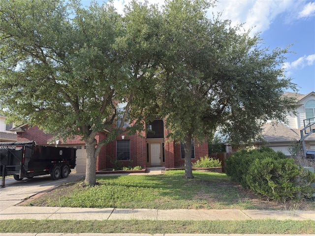 14604 Ballyclarc Dr, Austin, TX 78717 - obstructed view of property with brick siding, a front lawn, an attached garage, and concrete driveway