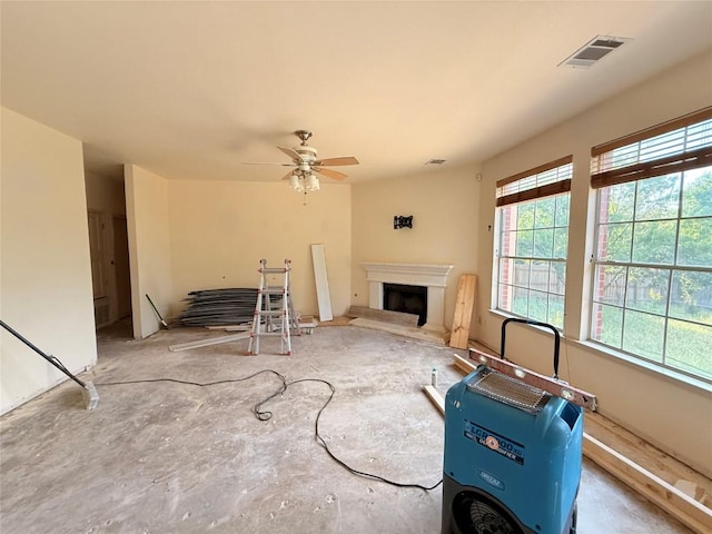 14604 Ballyclarc Dr, Austin, TX 78717 - living area with plenty of natural light, a fireplace with raised hearth, and ceiling fan