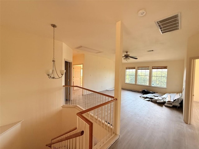 14604 Ballyclarc Dr, Austin, TX 78717 - hall featuring attic access, an upstairs landing, and wood finished floors