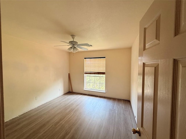14604 Ballyclarc Dr, Austin, TX 78717 - empty room with wood finished floors and a ceiling fan