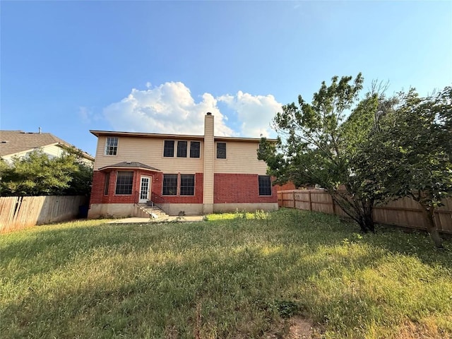 14604 Ballyclarc Dr, Austin, TX 78717 - rear view of house featuring entry steps, a chimney, and brick siding