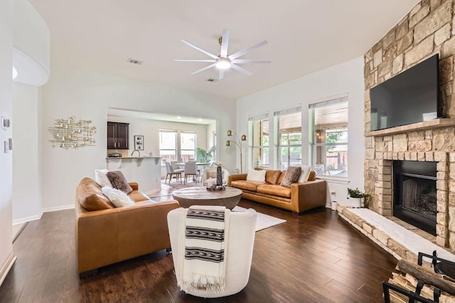 4349 Green Tree Dr, Round Rock, TX 78665 - living room with ceiling fan, dark wood finished floors, a fireplace, and baseboards