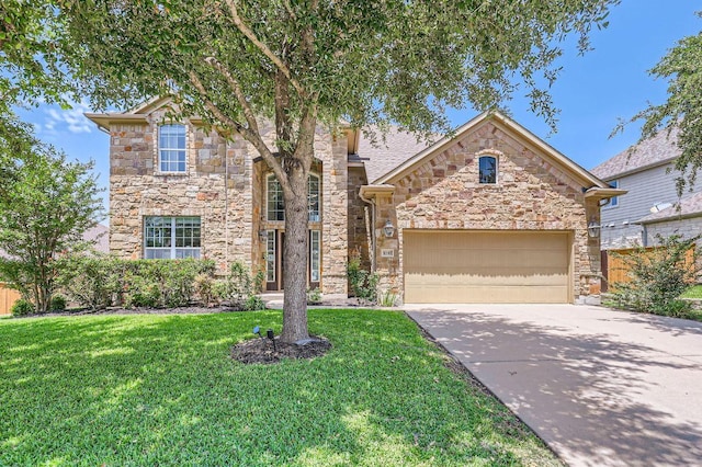 4349 Green Tree Dr, Round Rock, TX 78665 - traditional home featuring stone siding, a garage, and driveway