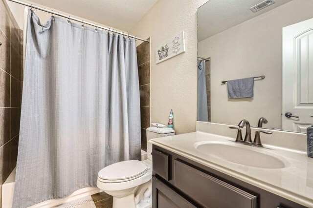 4349 Green Tree Dr, Round Rock, TX 78665 - bathroom with vanity, shower / tub combo, and toilet
