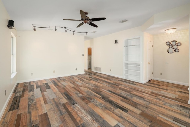 700 Horizon Trl, Cedar Park, TX 78613 - empty room featuring a ceiling fan, wood finished floors, track lighting, and built in shelves