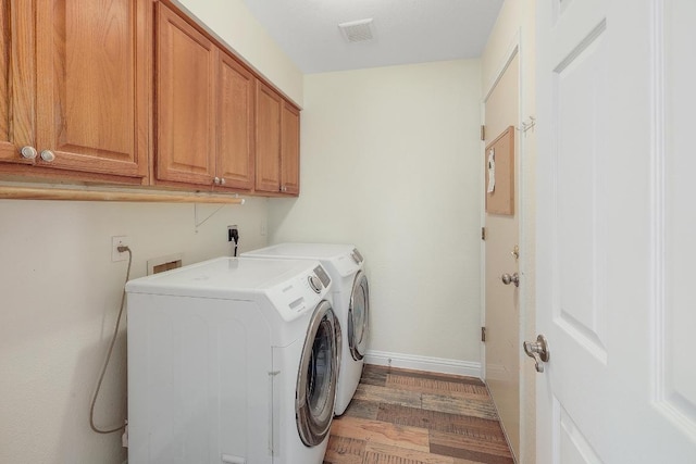 700 Horizon Trl, Cedar Park, TX 78613 - laundry room featuring cabinet space, wood finished floors, and independent washer and dryer