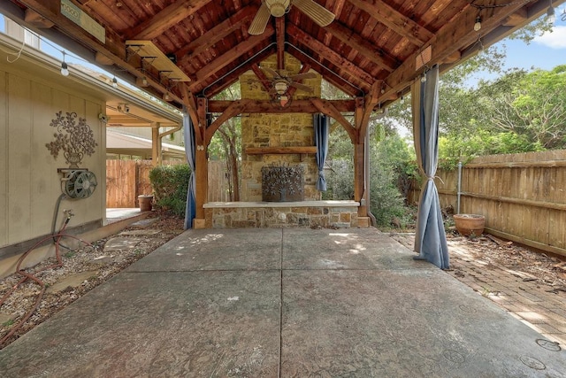 700 Horizon Trl, Cedar Park, TX 78613 - fenced backyard with an outdoor stone fireplace, a gazebo, a ceiling fan, and a patio