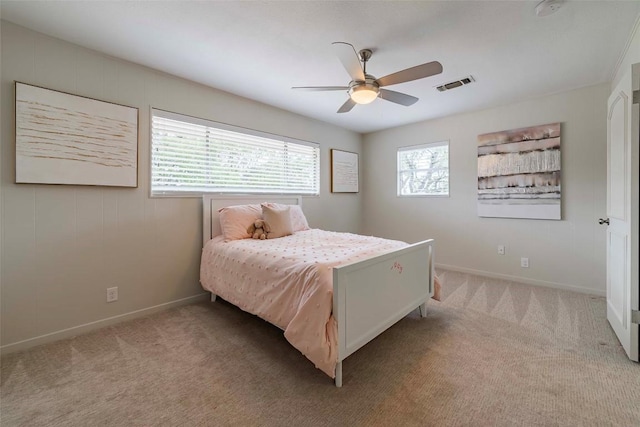 928 Porpoise St, Lakeway, TX 78734 - carpeted bedroom with baseboards and a ceiling fan