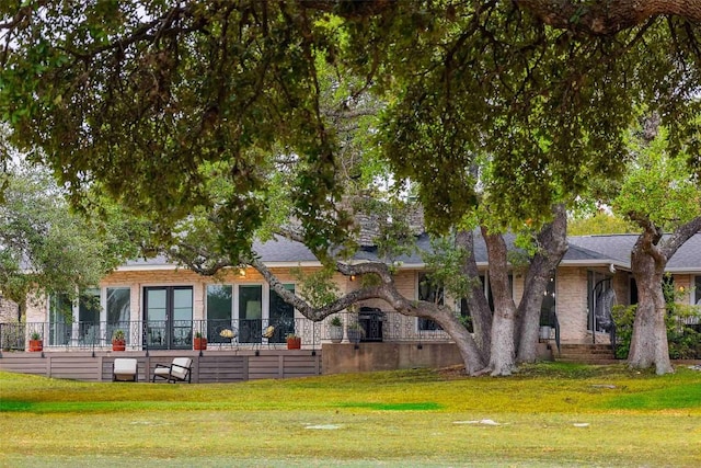 928 Porpoise St, Lakeway, TX 78734 - back of property featuring a lawn