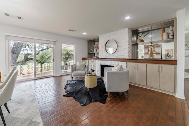 928 Porpoise St, Lakeway, TX 78734 - living room featuring a fireplace and recessed lighting