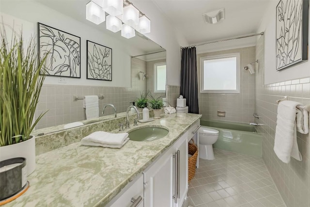 928 Porpoise St, Lakeway, TX 78734 - full bath featuring tile walls, toilet, tile patterned floors, shower / tub combo with curtain, and vanity