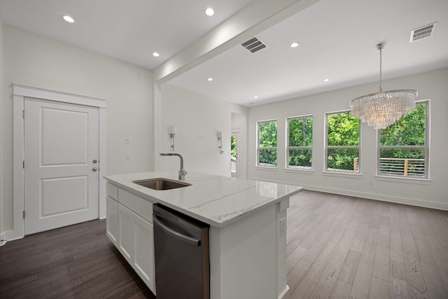 13501 Metric Blvd Unit 22, Austin, TX 78727 - kitchen with stainless steel dishwasher, a sink, dark wood-style flooring, white cabinets, and light stone counters