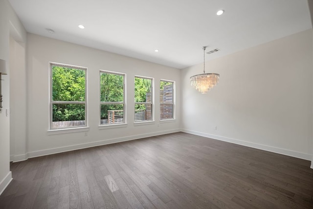 13501 Metric Blvd Unit 22, Austin, TX 78727 - empty room with a chandelier, baseboards, dark wood finished floors, and recessed lighting