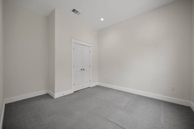 13501 Metric Blvd Unit 22, Austin, TX 78727 - empty room featuring dark colored carpet, baseboards, and recessed lighting