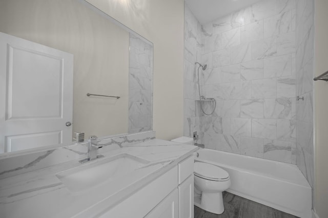 13501 Metric Blvd Unit 22, Austin, TX 78727 - full bath with vanity, toilet,  shower combination, and wood finished floors
