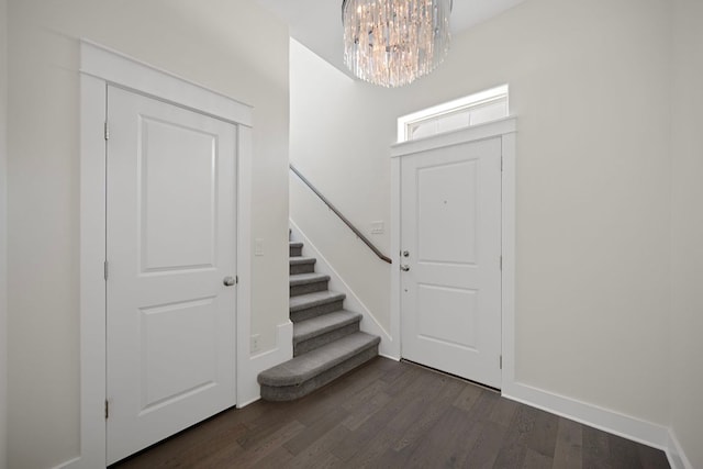 13501 Metric Blvd Unit 22, Austin, TX 78727 - foyer entrance featuring dark wood-style floors, a chandelier, stairway, and baseboards