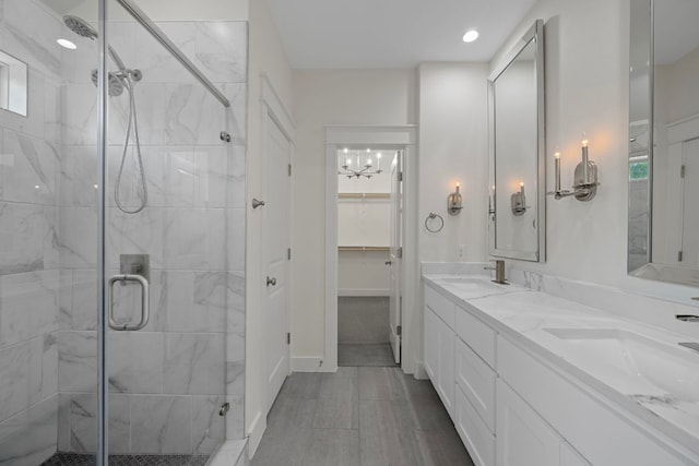 13501 Metric Blvd Unit 22, Austin, TX 78727 - full bathroom featuring a shower stall, a chandelier, and double vanity