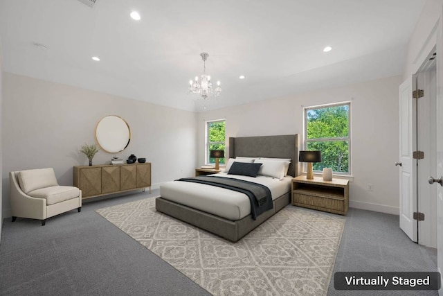 13501 Metric Blvd Unit 22, Austin, TX 78727 - bedroom featuring light carpet, a chandelier, recessed lighting, and baseboards