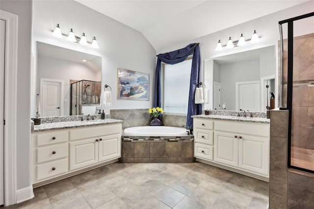 2628 Reunion Blvd, Austin, TX 78737 - full bath with a stall shower, two vanities, lofted ceiling, and a garden tub