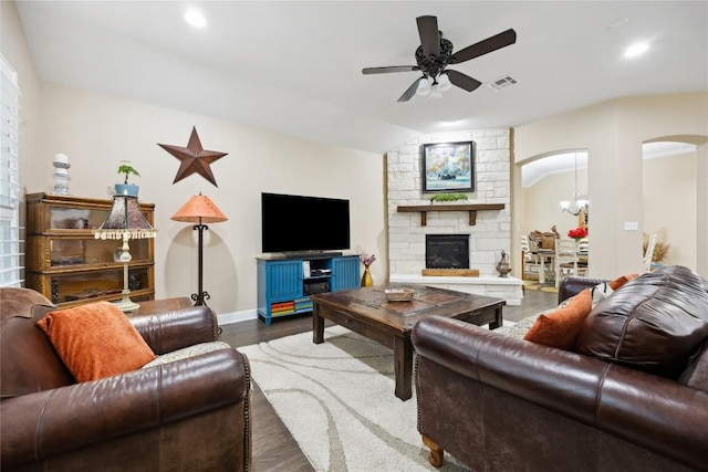 2628 Reunion Blvd, Austin, TX 78737 - living area featuring ceiling fan, arched walkways, a fireplace, wood finished floors, and vaulted ceiling