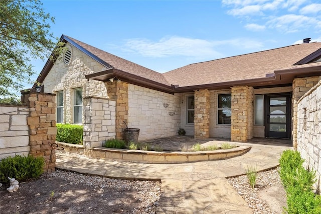 1020 Foothills Dr, Dripping Springs, TX 78620 - doorway to property featuring stone siding and a shingled roof