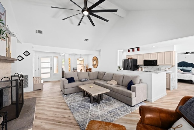 1020 Foothills Dr, Dripping Springs, TX 78620 - living area featuring a ceiling fan, beam ceiling, high vaulted ceiling, light wood-type flooring, and decorative columns