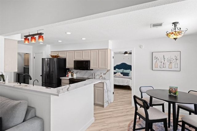 1020 Foothills Dr, Dripping Springs, TX 78620 - kitchen featuring black appliances, light wood-style flooring, recessed lighting, a ceiling fan, and a peninsula