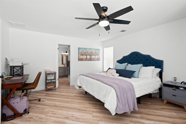 1020 Foothills Dr, Dripping Springs, TX 78620 - bedroom featuring light wood finished floors, an office area, ensuite bath, and ceiling fan