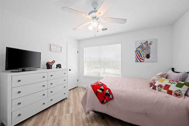 1020 Foothills Dr, Dripping Springs, TX 78620 - bedroom featuring light wood-style flooring and a ceiling fan