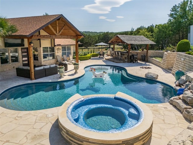 1020 Foothills Dr, Dripping Springs, TX 78620 - view of swimming pool featuring a gazebo, a patio area, a pool with connected hot tub, and an outdoor living space