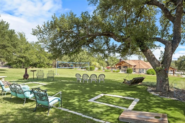 1020 Foothills Dr, Dripping Springs, TX 78620 - view of community with a lawn and volleyball court