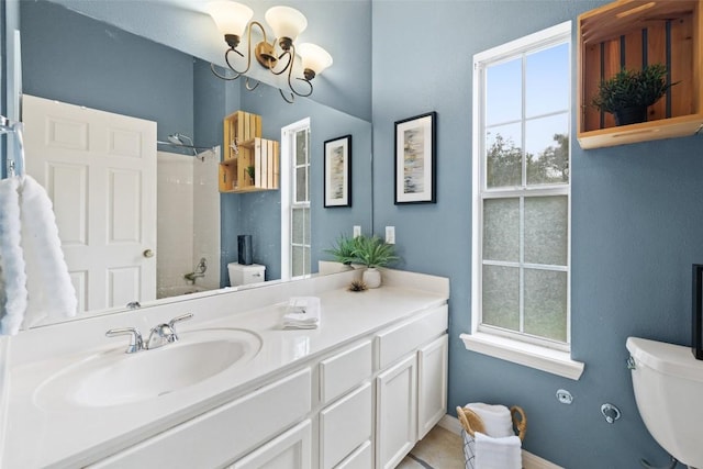 1301 S Quinlan Park Rd, Austin, TX 78732 - bathroom with toilet, a chandelier, a shower, vanity, and baseboards