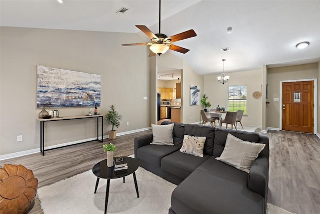 1301 S Quinlan Park Rd, Austin, TX 78732 - living room with wood finished floors, a chandelier, ceiling fan, and high vaulted ceiling