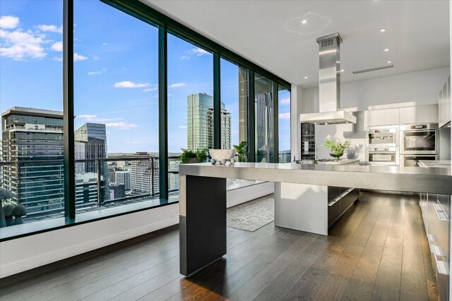 210 Lavaca St Unit 3603, Austin, TX 78701 - dining area with a city view, dark wood-style floors, recessed lighting, and expansive windows