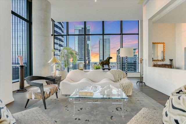 210 Lavaca St Unit 3603, Austin, TX 78701 - living area with baseboards, wood finished floors, a wall of windows, and a city view